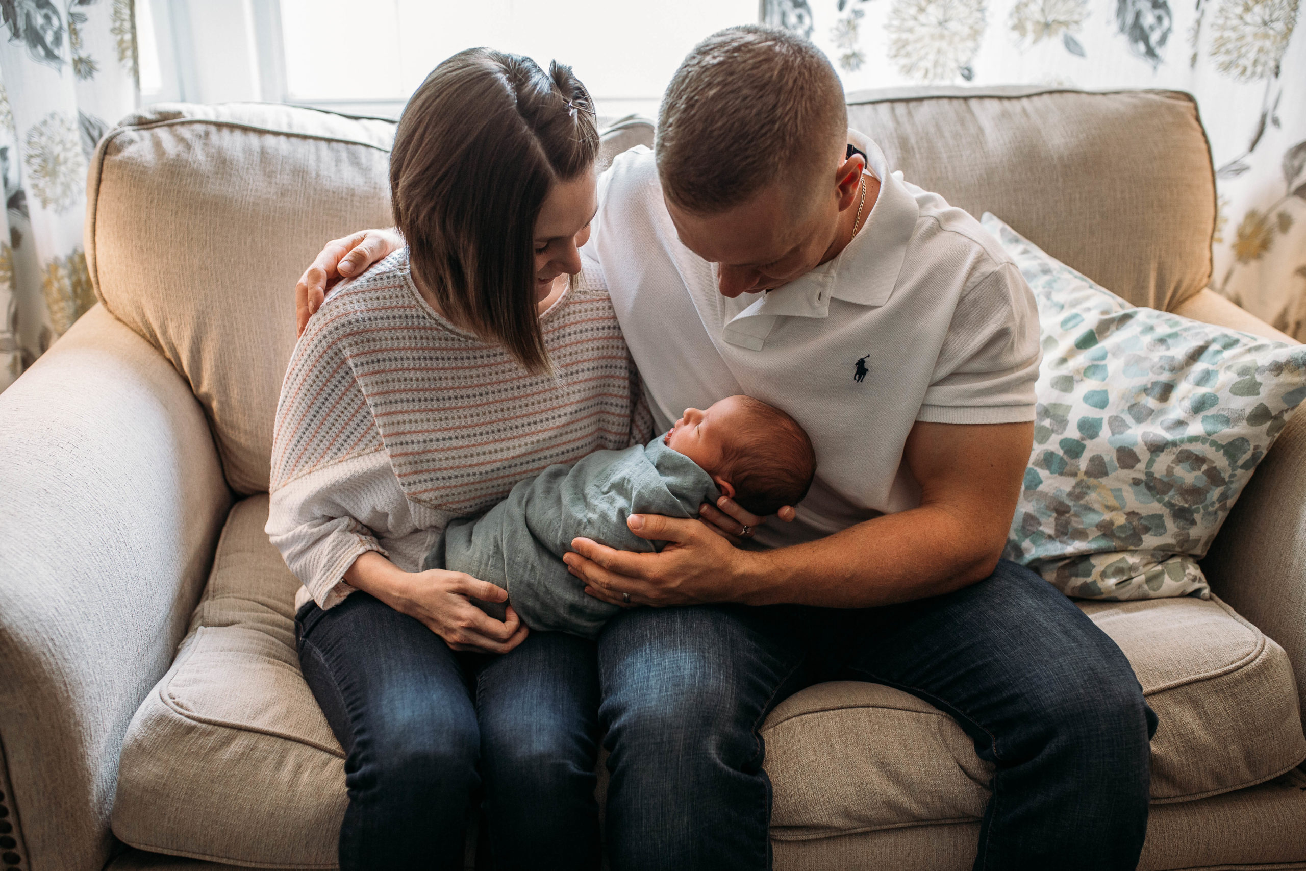 Parents holding newborn baby for boston newborn photographer