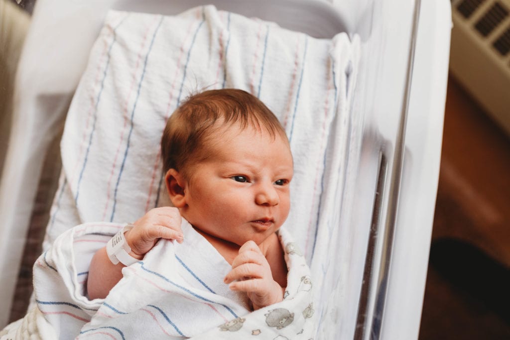 newborn in boston hospital bassinet
