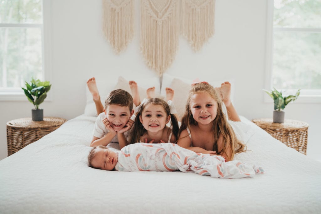 kids laying on a bed