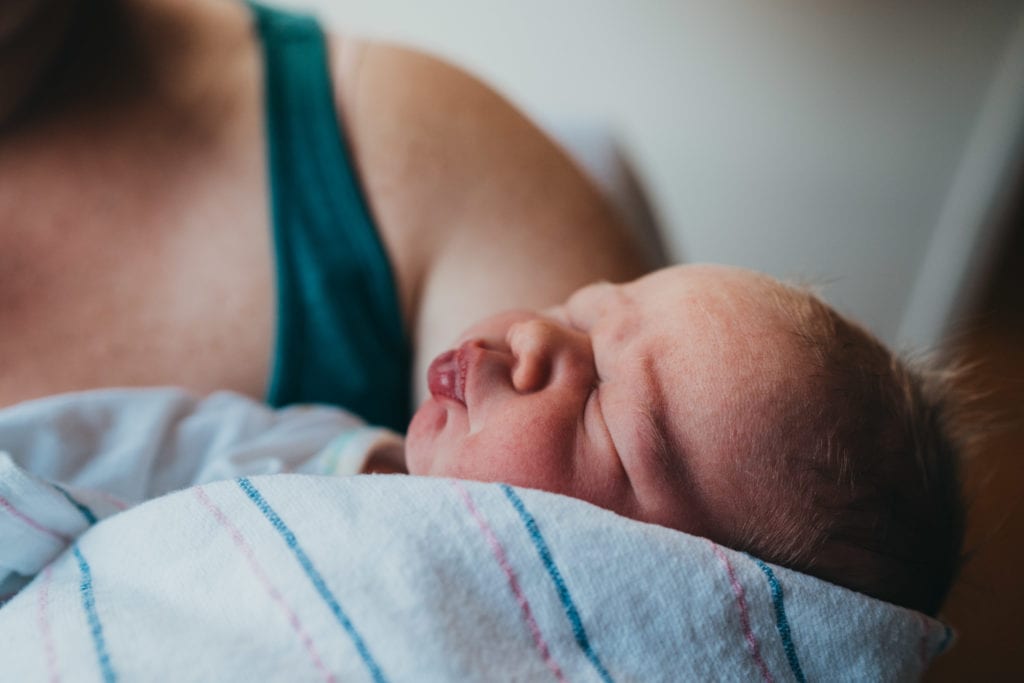 Newborn sleeping in boston birthing center